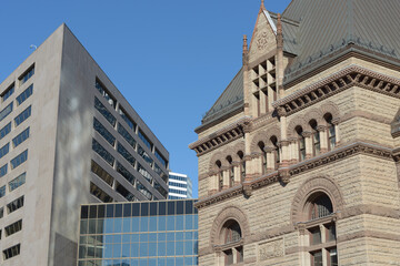 Naklejka premium detail of exterior building facade of Old City Hall, a Romanesque-style municipal gov and court house designed by Edward James Lennox, 1899 at 60 Queen St W in Toronto, ON