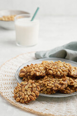 A heap of Portugues traditional peanut cookies known as Bolachas de Amendoim on the grey plate