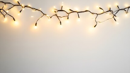 A String of Warm White Christmas Lights on a White Wall