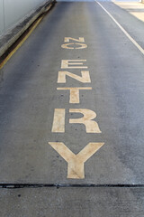 Fototapeta premium Yellow No Entry sign painted on a concrete asphalt bitumen road