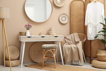 Stylish dressing table with mirror in room