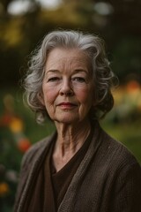 A woman with silver hair looks directly at the camera. AI.