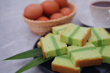 pandan cake on black plate. Selective focus.