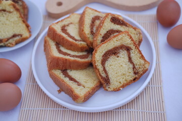 sponge cake on a white plate with beautiful decoration