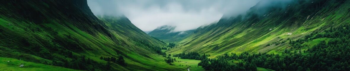 Cloud shadows over a lush mountain valley