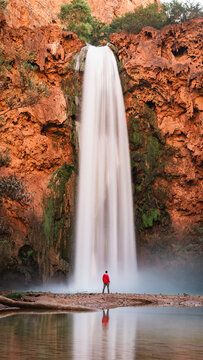 Mooney waterfall with hiker at Havasupai