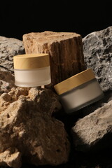 Elegant Skincare Cream Jars with Wooden Lids on Rustic Rock Display