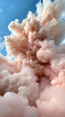 Dreamy clouds of wispy cotton candy pink against blue sky