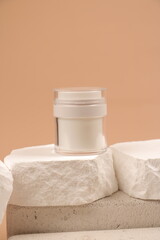 White Cosmetic Cream Jar on Natural Stone with Neutral Beige Background