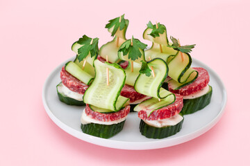 Canapes without Bread with Salami, Cucumber, Greens and Cream Cheese on White Plate. Easy Breakfast. Diet Food. Quick and Healthy Sandwiches. Healthy Snacks with Tasty Fillings