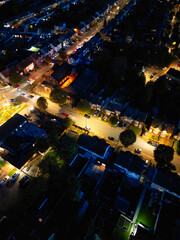 Aerial Night View of Illuminated Luton City Homes During Full Moon Night of October 27th, 2023