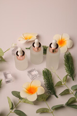 Collection of Frosted and Amber Glass Dropper Bottles with Floral and Botanical Decor