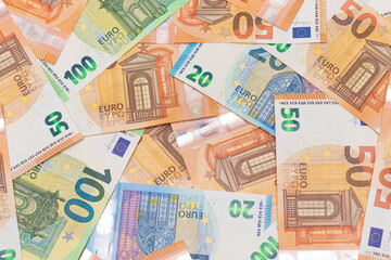 Different Euro Banknotes Money Background. Euro Money Currency. Colored Paper Money. A Lot of Fifty Euro Bills. Business, Finances, Cash and Money Saving Concept
