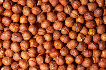 Scattered Peeled Hazelnut - Top View. Background from Hazelnuts. Natural High-Calorie Snacks