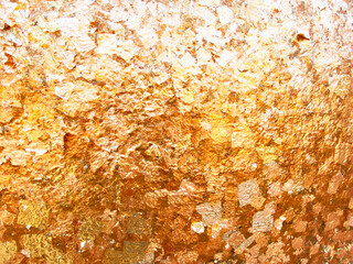 Abstract gold leaf or gold foil texture wallpaper background