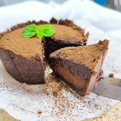 Slice Molten Chocolate Lava Pie, topped with mint leaf, Lava cake, Chocolate Cheese Pie, Baked.