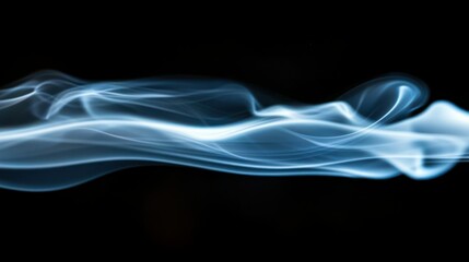 Fototapeta premium Blue smoke rising in soft, ethereal tendrils against a black background.