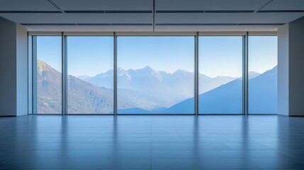 Fototapeta premium A spacious room with large windows showcasing a scenic mountain view.