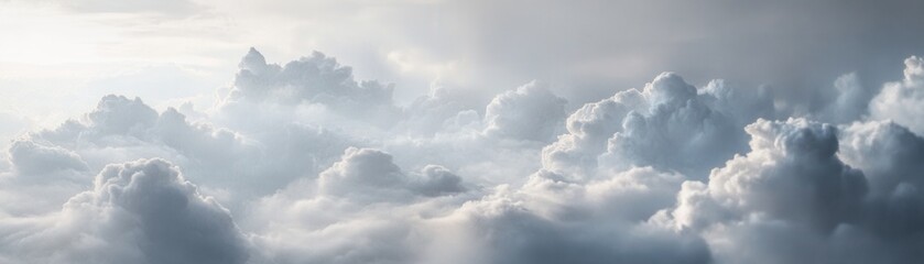 Fototapeta premium A Panoramic View of Fluffy White Clouds Against a Bright Sky