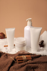 White Cosmetic Tubes, Jar, and Pump Bottle with Rustic Decor and Natural Elements