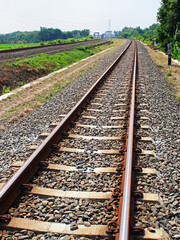 View of the railway tracks on a sunny day.