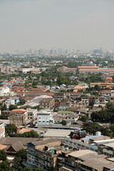 An expansive aerial view of Bangkok urban landscape featuring a dense array of buildings and residences.