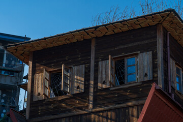 Upside-Down Wooden House: A Sunlit Tourist Attraction with Open Windows. 