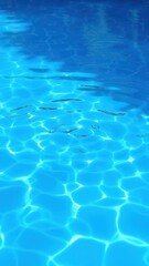 Obraz premium Vivid blue pool water with ripples and reflections of surrounding greenery, poolside, blue