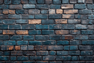 Obraz premium A high-resolution texture of weathered, multi-colored bricks is perfect for background use in design projects, adding a touch of history and rustic charm.