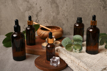 Amber Glass Dropper Bottles with Natural Decor on Rustic Background