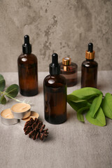 Amber Glass Dropper Bottle with Pinecone and Greenery on Rustic Background