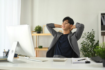 Relaxed businessman enjoying a short break in his workspace