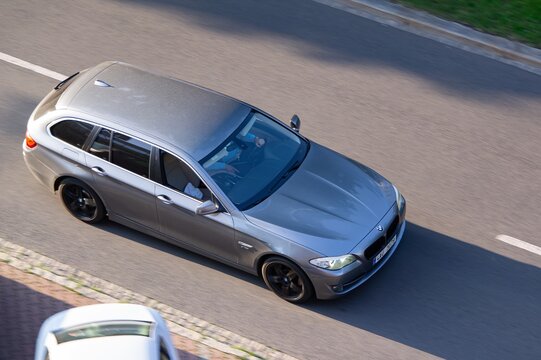 Silver BMW 5-Series Touring F11 estate car, motion blur effect