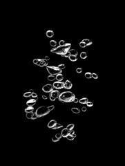 White bubbles, liquid, black background, abstract isolated, oxygen design concept, underwater, water droplets, small under the sea, soda effect, transparent