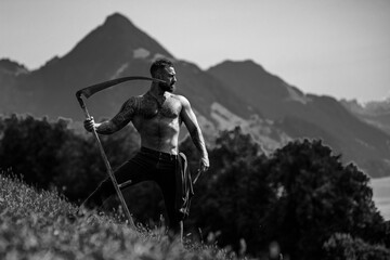 Sexy Man farmer on countryside farm. Farmer with bare naked torso. Muscular sexy farm worker in the farm field. Strong shirtless Farmer on rural farm. Male farmer at his land.