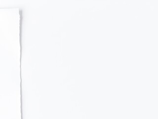 Close-up of white paper with a textured background, textured