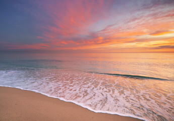 Sandy seashore at sunset