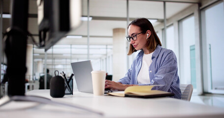 Focused Woman Utilizing Digital Tools For Online Education In Office - Student