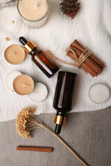 Amber Glass Dropper Bottles with Spa Elements on Rustic Background