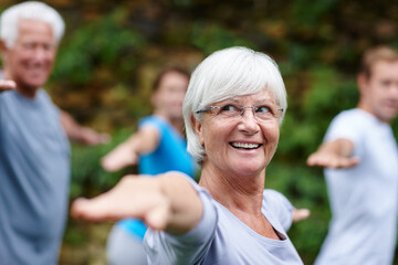 Stretching, exercise and old woman in nature with yoga class for spiritual retreat, peace and zen....