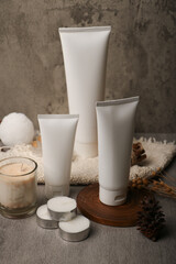 Minimalist White Cosmetic Tube with Natural Decorations on Rustic Background