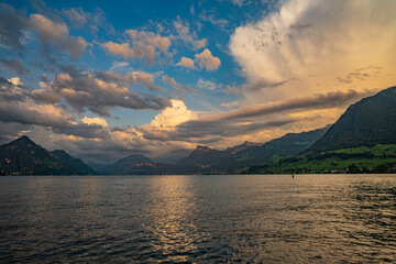 Fototapeta premium Mountain in the in summer, panoramic view with mountain. Alps mountains. Alpine mountain scenery. Mountain with lake in Alps. Mountains over the lake and the alps.