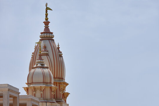 Temple, spire and space in sky for religion, worship and travel wallpaper in India. Naba Brindaban, culture and architecture in city for Hinduism, spiritual atmosphere and Holy building for praise