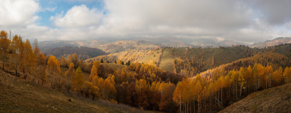 Fototapeta Panoramic overview of Magura village in Romania, near the Piatra Craiului mountains