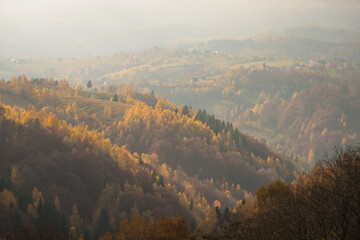 Scenic autumn overview of Magura village in Romania, near the Piatra Craiului mountains