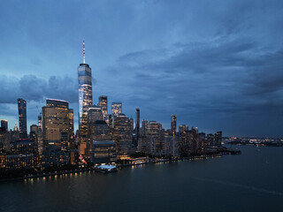 Obraz premium NYC aerial night view. New York City skyline, cityscape of Manhattan in USA. New York City NYC Manhattan Downtown Skyline, from Jersey City USA.