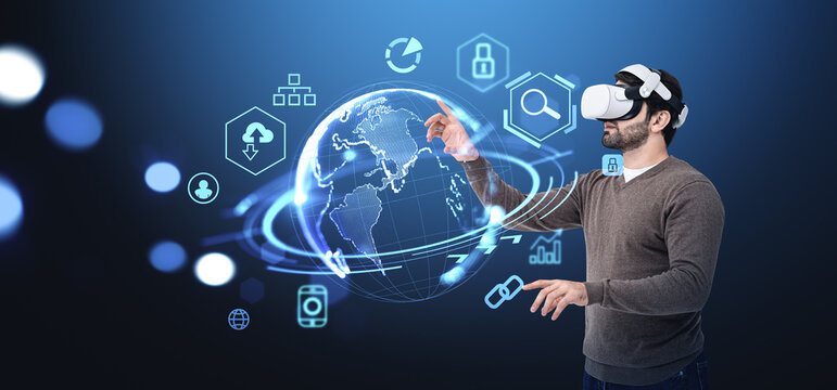 Young man in vr glasses, digital hud with earth and web icons