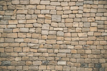 Obraz premium a close-up view of a wall constructed from irregularly shaped stones