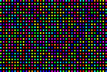 Obraz premium colored dots or filled circles randomly colored on a neatly arranged grid on black