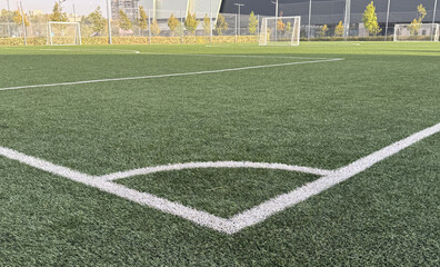 Artificial grass soccer field. Corner kick line of ball and a soccer field , football field ,...